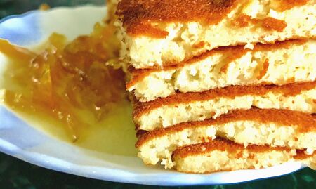 Slices of pancakes and jam in the plateの素材