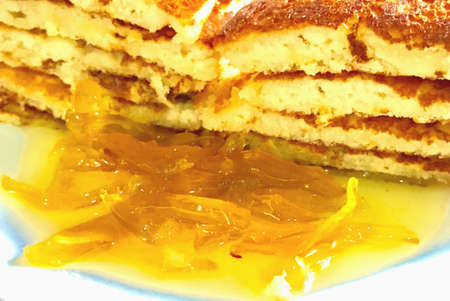 Slices of pancakes and jam in the plateの素材