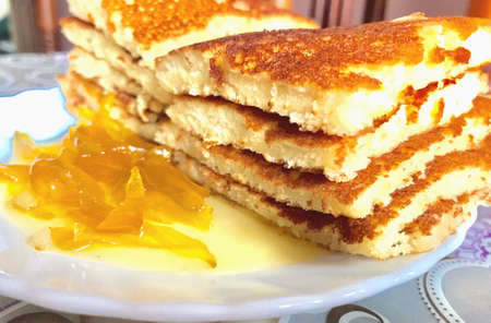 Slices of pancakes and jam in the plateの素材