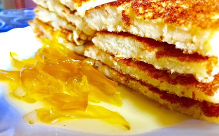 Slices of pancakes and jam in the plateの素材
