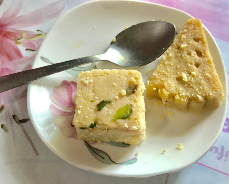 A plate of sweets and a spoonの素材