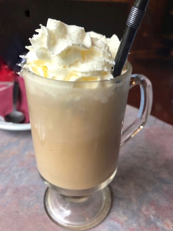 A mug of cold coffe with creamの素材