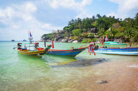 Longtail boats on the beach and jungle of koh tao in the gulf of thailandのeditorial素材