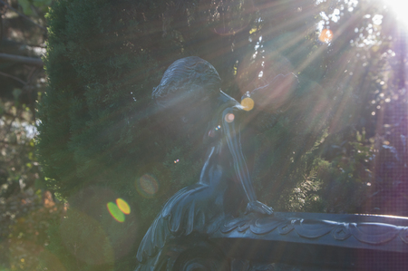 bronze sculpture of little angels in the park in high qualityの写真素材