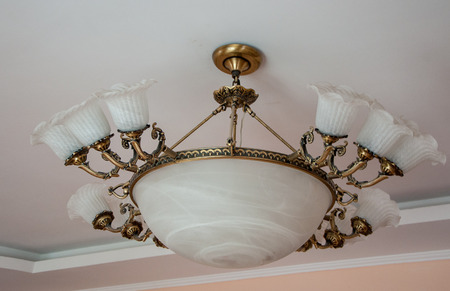 a large white vintage chandelier in high qualityの写真素材