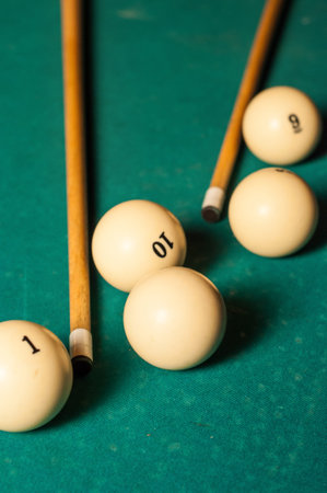 billiard cue and balls on a green table in high quality 