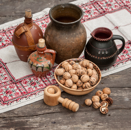 walnuts and vintage crockery on a wooden table in high qualityの写真素材