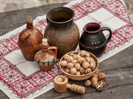 walnuts and vintage crockery on a wooden table in high qualityの写真素材