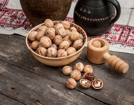 walnuts and vintage crockery on a wooden table high qualityの写真素材