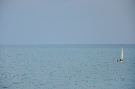 Boat in the sea surface on a sunny day in high qualityの写真素材