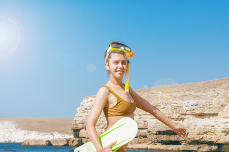 Beautiful girl in accessories for diving on the background of the sea. High qualityの写真素材