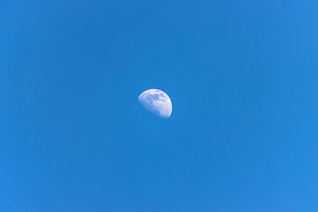 Moon in the blue sky, closeup of photo with selective focusの写真素材