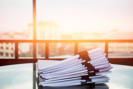 Pile of unfinished documents on office desk, Stack of business paper