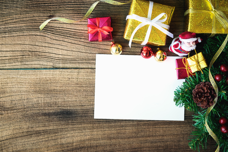 Christmas gift boxes on wooden table with place for copy spaceの写真素材