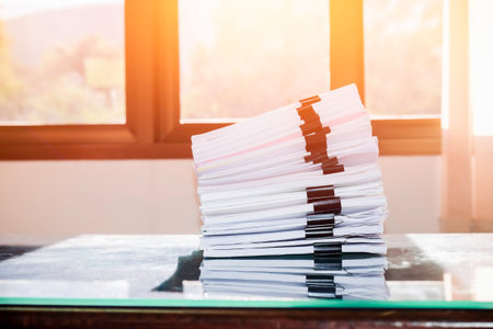 Pile of unfinished documents on office desk, Stack of business paper