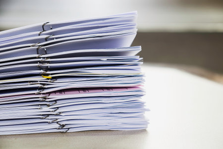 Pile of unfinished documents on office desk, Stack of business paper