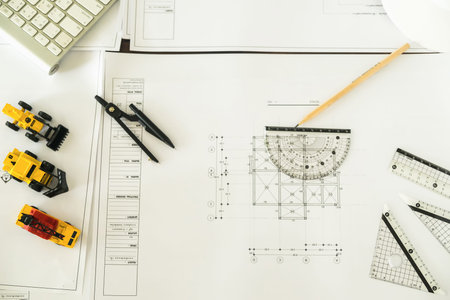 Workplace of architect - Architectural project, blueprints, blueprint rolls and divider compass on...