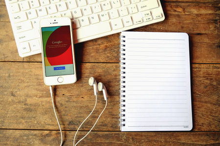 CHIANGMAI, THAILAND -April 14, 2016:Brand new Apple iPhone with Google+ social network of the Google company. Information of a social network, influences Google search results.のeditorial素材