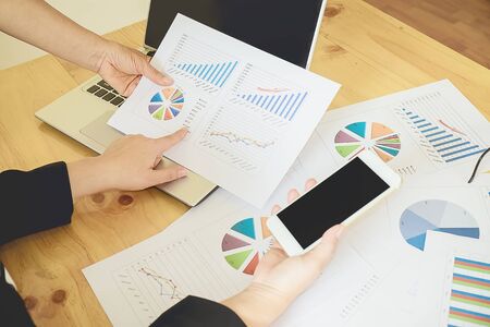 Business people discussing the charts and graphs showing the results at meeting. Business concept.の写真素材
