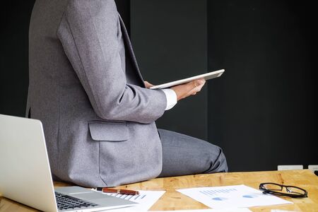 Business people using touchpad meeting to discuss the situation on the marketing in the meeting roomの写真素材