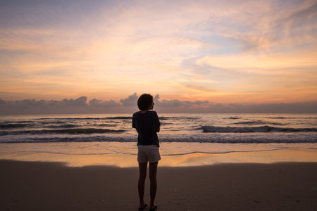 girl waiting for the Sunrise.の写真素材
