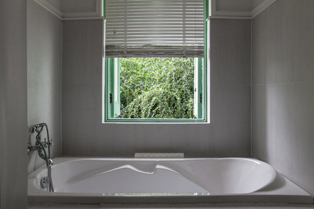 White bathtub in grey bathroom.の写真素材