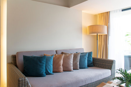 Wicker furniture and colorful pillows.