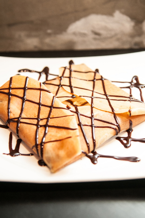 Close-up shot of crape with chocolate sauce.の写真素材