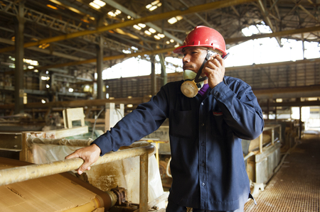 Padaeng industry, Mae Sot, Tak, Thailand February,20 2013 : Zinc mine. Engineer communicate through walkie talkieのeditorial素材