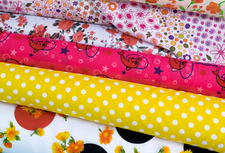 Colors and pattern of fabric in fabric store. Type of fabric.