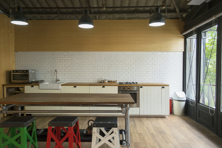 Corner of the white kitchen. The kitchen is decoration with white tile and wooden.の写真素材