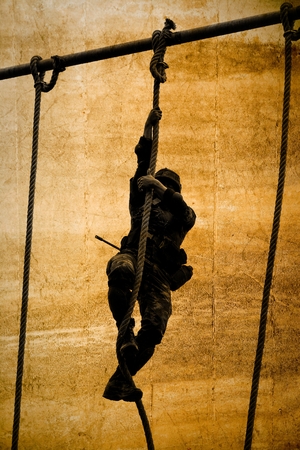 soldier climbing ropeの写真素材