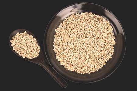 millets in black bowl on black backgroundの写真素材