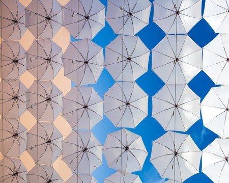 a group of  white umbrella  on bright blue skyの写真素材