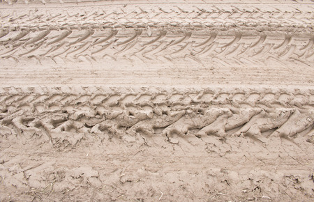 Tractor traits on dirt roadの写真素材