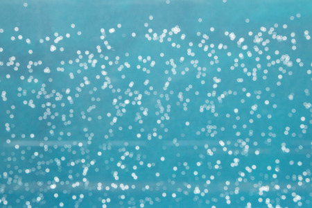 Bokeh of air bubbles in waterの写真素材