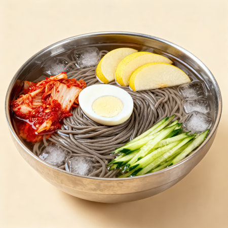 cold buckwheat noodles with kimchi and vegetables in bowlの素材
