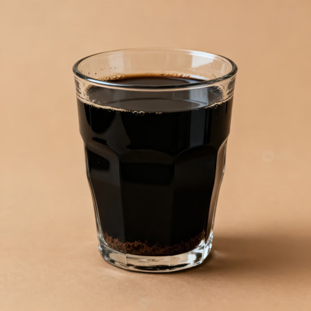 coffee in a glass on a brown background, close-upの素材