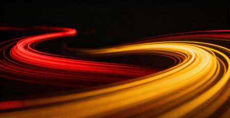 abstract light trails on the black background. long exposure photo.の素材