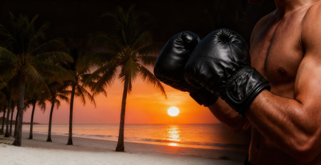 Boxing gloves on the beach during sunset with palm trees in the backgroundの素材