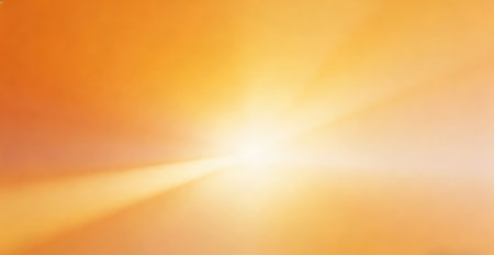 Abstract orange background with sun rays and bokeh effect. Soft focus.の素材