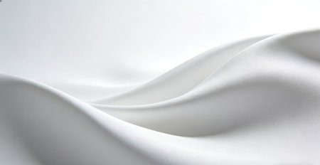 closeup of white satin fabric on white background with copy spaceの素材