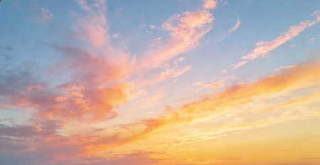 Sunset sky background with tiny clouds and orange and blue colors.の素材