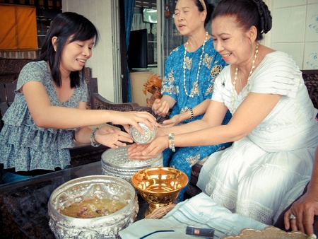pour water on the hands of revered elders and ask for blessing in Songkarn festivalのeditorial素材