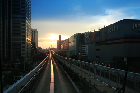 TOKYO, JAPAN - JANUARY 01: Visitors seeing the rialways of electric train ride to Odaiba with sunset in Tokyo on January 01,2012, Tokyo Japanのeditorial素材