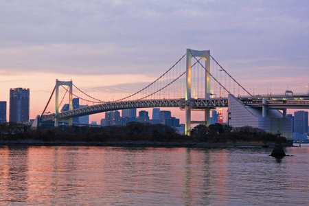 Rainbow bridge with sun light at Odaiba , Japanの写真素材