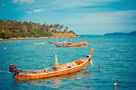 Wooden boat in the sea at Phuket, Thailandの写真素材