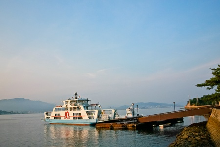 HIROSHIMA, JAPAN - AUGUST 15  People board Miyajima Matsudai Kisen ferry on August 15, 2011 in Hiroshima, Japan  The company operates ferries to famous Miyajima island since 1967 のeditorial素材