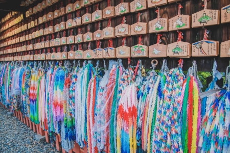 Hundreds of origami cranes - colorful background at Fushimi Inari shrine in Kyoto prefecture, Japan. のeditorial素材