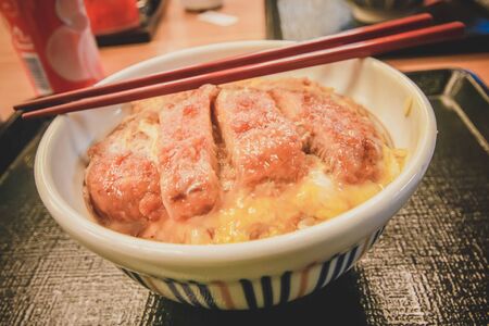 Tonkatsu - Japanese breaded deep fried pork cutlet served with shredded cabbage and steamed rice  の写真素材